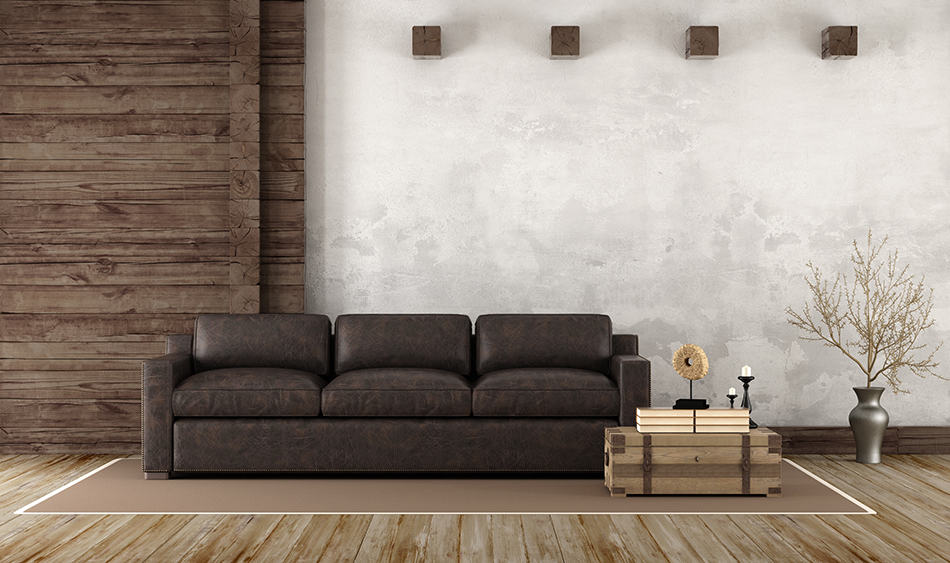 Brown Leather Couch Next to Brown Wall as a Focal Point